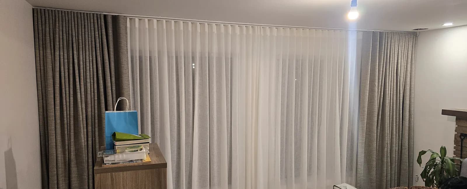 Custom curtains and sheer in a living room in Longueuil