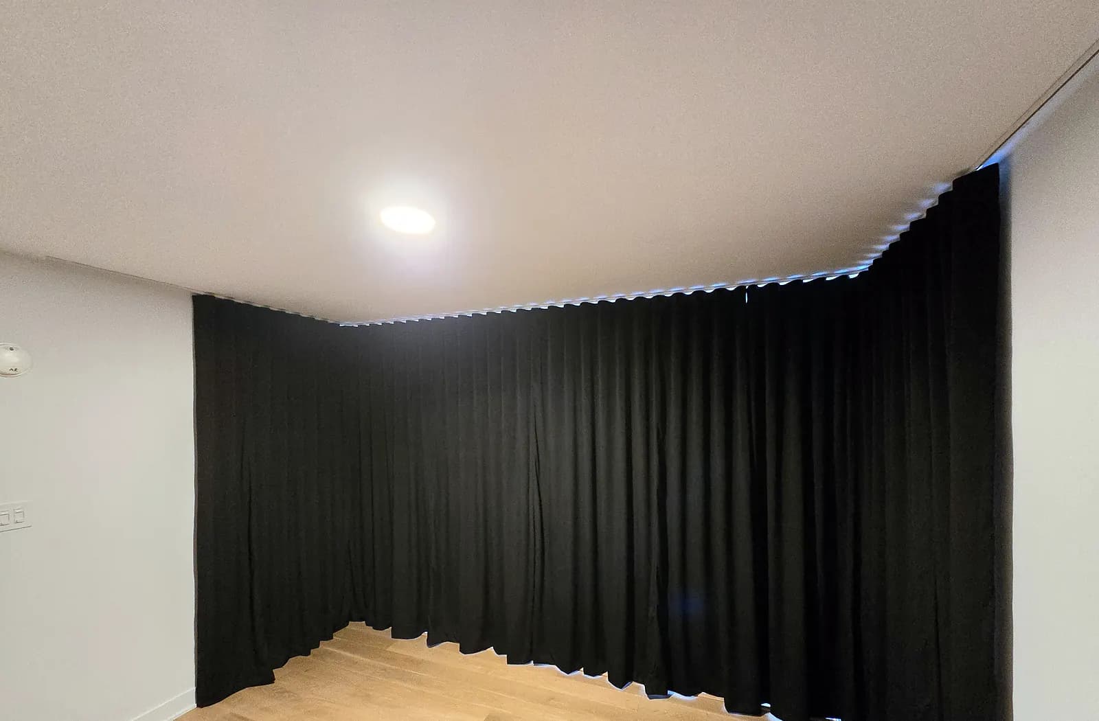 Acoustic curtains in blackout velvet, on a ceiling track, condo mezzanine in Montreal